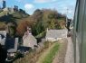 Swanage steam train with Corfe Castle to the left